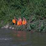Buddhist monks taking a swim